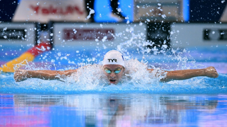 Sleepless in Singapore: Marchand wins gold, day after world record