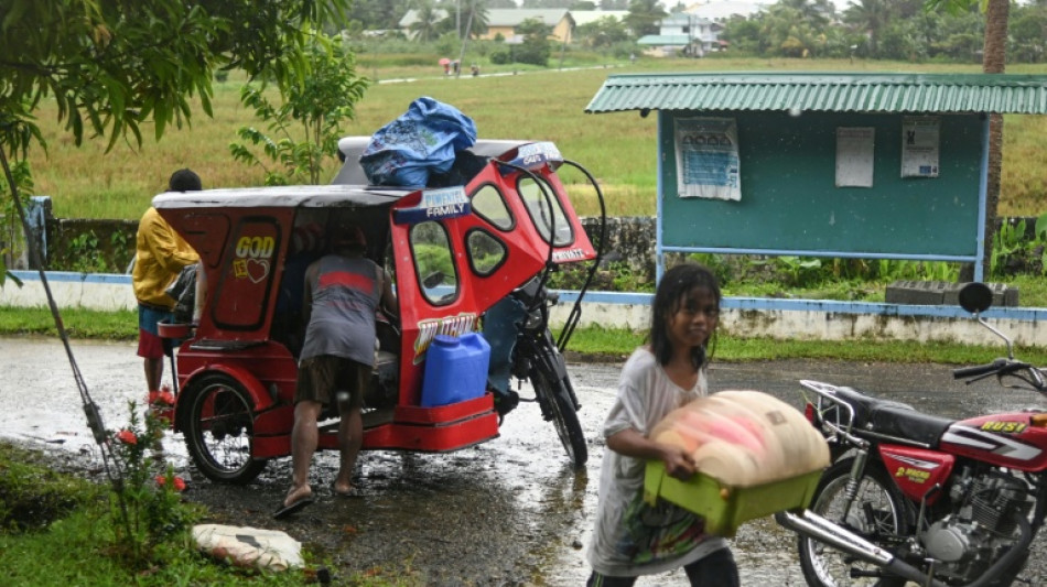 Tens of thousands shelter as typhoon slams into Philippines