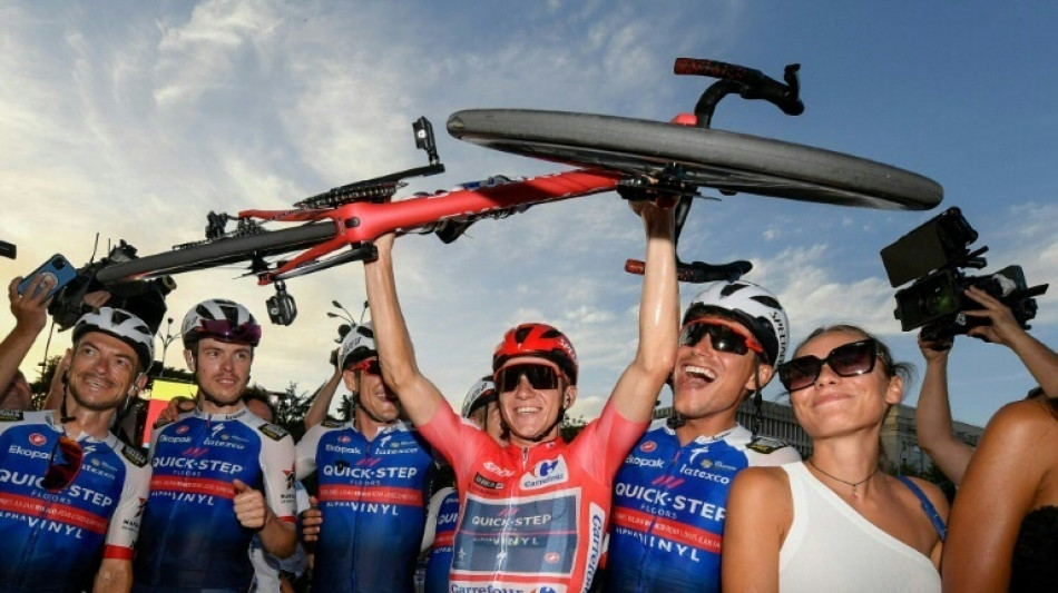Belgian Evenepoel wins 'historic' Grand Tour at Vuelta a Espana