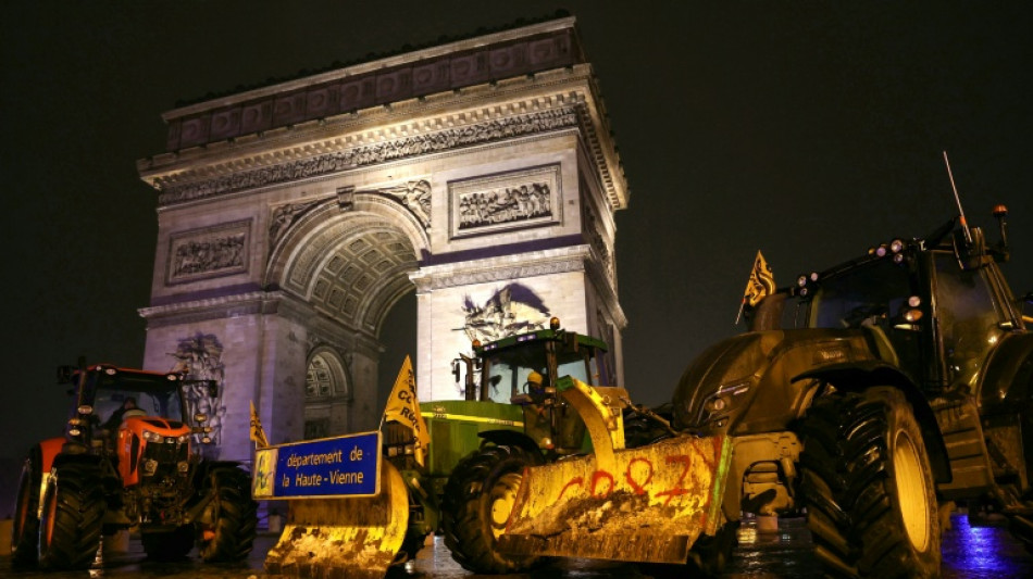 Farmers enter Paris on tractors in protest at trade deal