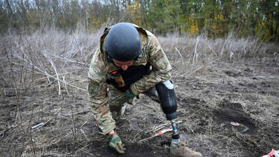 'Someone has to do it': Ukrainian amputee deminers back in the field