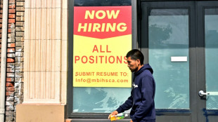 US unemployment up even as hiring beats expectations in delayed report