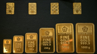 Gold nears $5,000, silver shines as stocks churn to end turbulent week