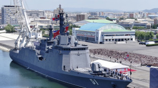 North Korea's Kim unveils plans for 10,000-tonne warships, nuclear navy 