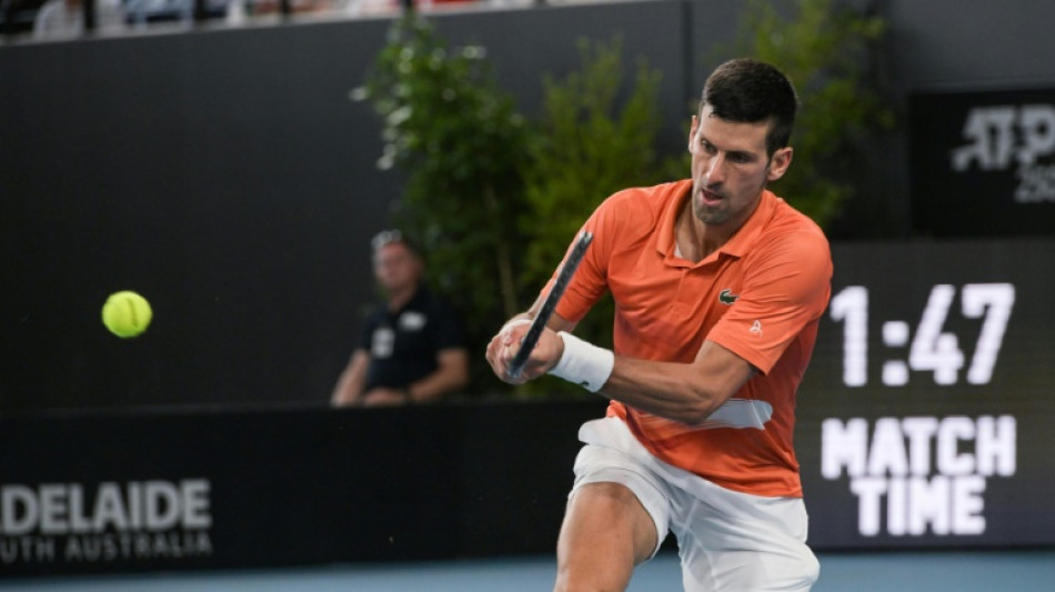 Djokovic taken to limit before winning Adelaide title  