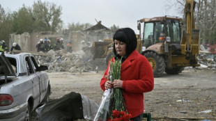 Grief and suspicion in Ukraine village hit by deadly strike