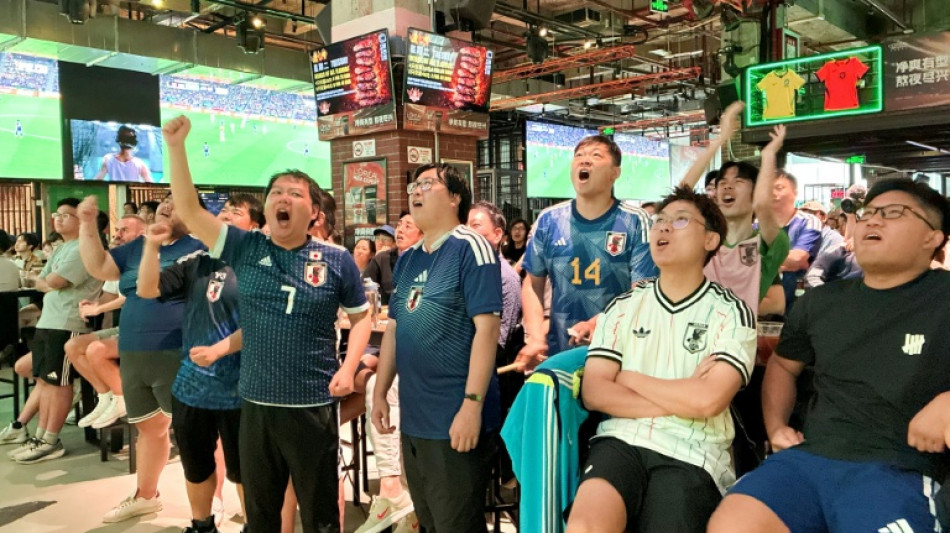 Fans in China put politics aside to cheer Japan at World Cup