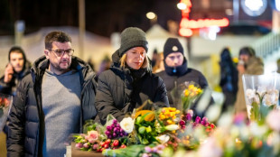 Tears and stunned silence at vigil for Swiss fire victims